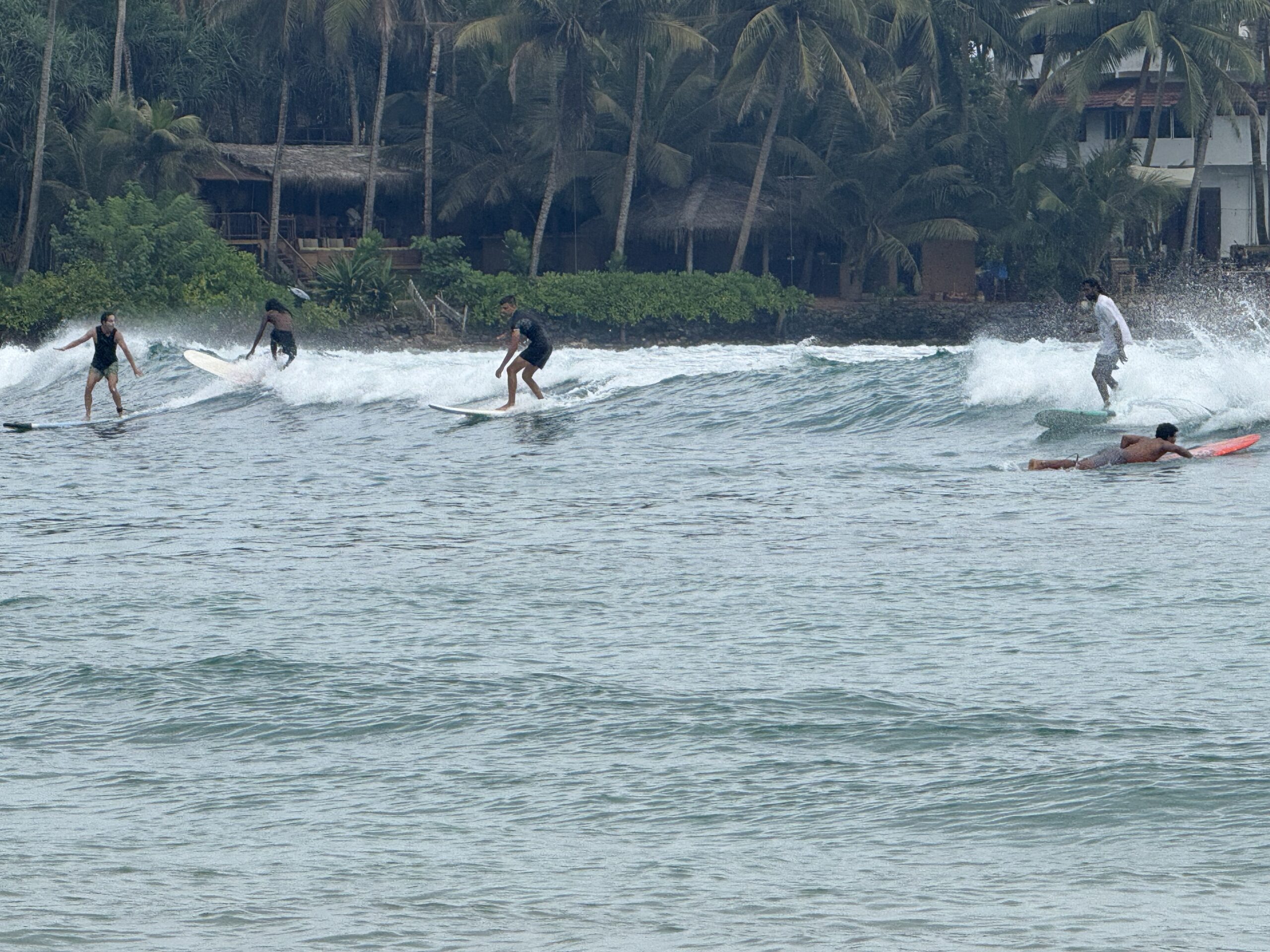 Surfers at Hiriketiya Beach